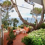Villa in Bahia Grande - Im Grünen eingebettete Terrasse mit Meerblick